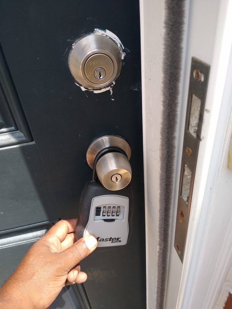 Lockbox with mechanical combination on residential door